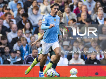 Jack Grealish #10 of Manchester City F.C. is in action during the Premier League match between Manchester City and Brentford at the Etihad S...