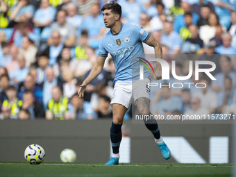 John Stones #5 of Manchester City F.C. during the Premier League match between Manchester City and Brentford at the Etihad Stadium in Manche...