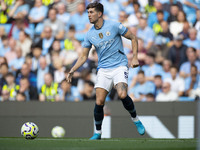 John Stones #5 of Manchester City F.C. during the Premier League match between Manchester City and Brentford at the Etihad Stadium in Manche...