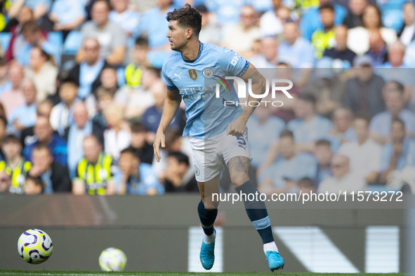 John Stones #5 of Manchester City F.C. during the Premier League match between Manchester City and Brentford at the Etihad Stadium in Manche...