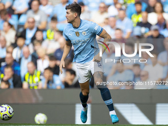 John Stones #5 of Manchester City F.C. during the Premier League match between Manchester City and Brentford at the Etihad Stadium in Manche...