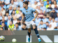 John Stones #5 of Manchester City F.C. during the Premier League match between Manchester City and Brentford at the Etihad Stadium in Manche...