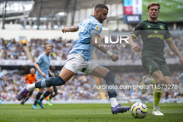 Kyle Walker #2 of Manchester City F.C. crosses the ball during the Premier League match between Manchester City and Brentford at the Etihad...