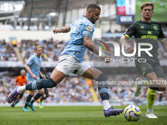 Kyle Walker #2 of Manchester City F.C. crosses the ball during the Premier League match between Manchester City and Brentford at the Etihad...