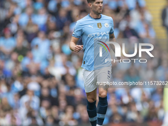 John Stones #5 of Manchester City F.C. during the Premier League match between Manchester City and Brentford at the Etihad Stadium in Manche...