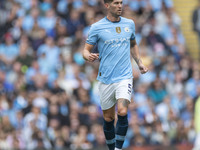 John Stones #5 of Manchester City F.C. during the Premier League match between Manchester City and Brentford at the Etihad Stadium in Manche...