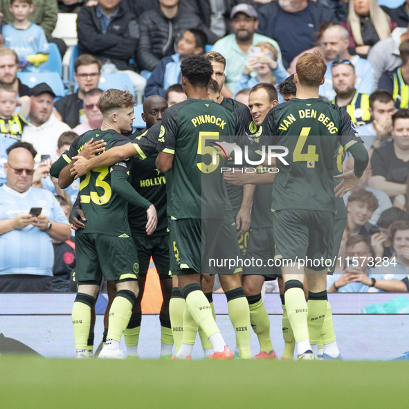 Brentford F.C. celebrate the goal during the Premier League match between Manchester City and Brentford at the Etihad Stadium in Manchester,...