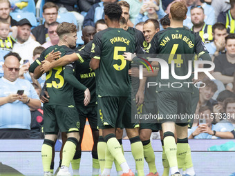 Brentford F.C. celebrate the goal during the Premier League match between Manchester City and Brentford at the Etihad Stadium in Manchester,...