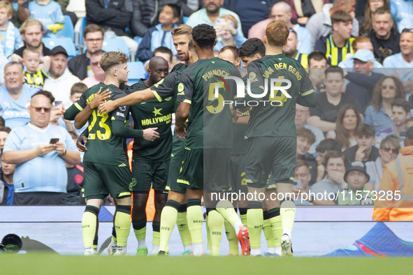 Brentford F.C. celebrate the goal during the Premier League match between Manchester City and Brentford at the Etihad Stadium in Manchester,...