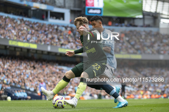 Keane Lewis-Potter #23 of Brentford F.C. in action during the Premier League match between Manchester City and Brentford at the Etihad Stadi...