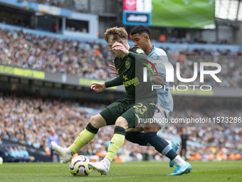 Keane Lewis-Potter #23 of Brentford F.C. in action during the Premier League match between Manchester City and Brentford at the Etihad Stadi...