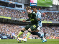 Keane Lewis-Potter #23 of Brentford F.C. in action during the Premier League match between Manchester City and Brentford at the Etihad Stadi...