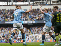 Erling Haaland #9 of Manchester City F.C. celebrates his goal with Kevin De Bruyne #17 of Manchester City F.C. during the Premier League mat...