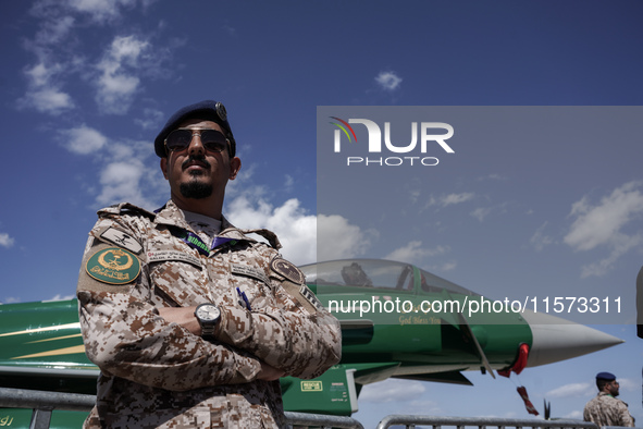 A Royal Saudi Air Force pilot poses in front of an aircraft during the Athens Flying Show in Tanagra, Greece, on September 14, 2024. 