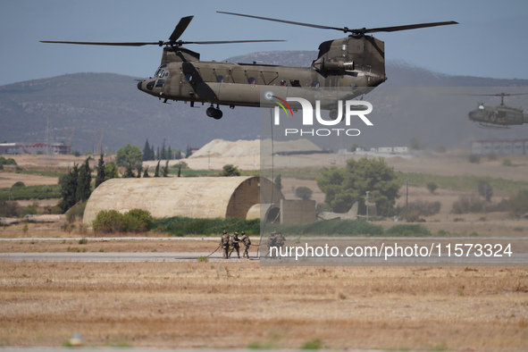 A Boeing CH-47 Chinook helicopter performs demonstrations during the Athens Flying Show in Tanagra, Greece, on September 14, 2024. 