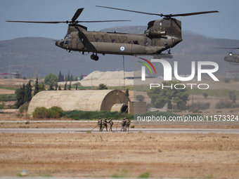 A Boeing CH-47 Chinook helicopter performs demonstrations during the Athens Flying Show in Tanagra, Greece, on September 14, 2024. (