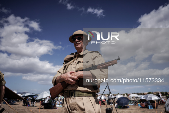 Members of the Greek Army reenact a WWII scene during the Athens Flying Show in Athens, Greece, on September 14, 2024 