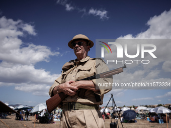 Members of the Greek Army reenact a WWII scene during the Athens Flying Show in Athens, Greece, on September 14, 2024 (