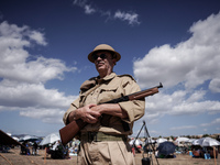 Members of the Greek Army reenact a WWII scene during the Athens Flying Show in Athens, Greece, on September 14, 2024 (