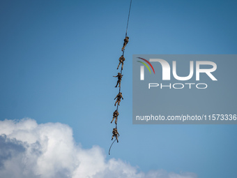 Members of the Greek Special Forces conduct demonstration exercises during the Athens Flying Show in Tanagra, Greece, on September 14, 2024...