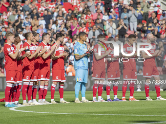 Middlesbrough players applaud during a tribute to Sol Bemba during the Sky Bet Championship match between Middlesbrough and Preston North En...