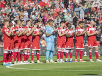 Middlesbrough players applaud during a tribute to Sol Bemba during the Sky Bet Championship match between Middlesbrough and Preston North En...