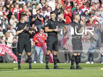 Officials applaud during a tribute to Sol Bemba during the Sky Bet Championship match between Middlesbrough and Preston North End at the Riv...