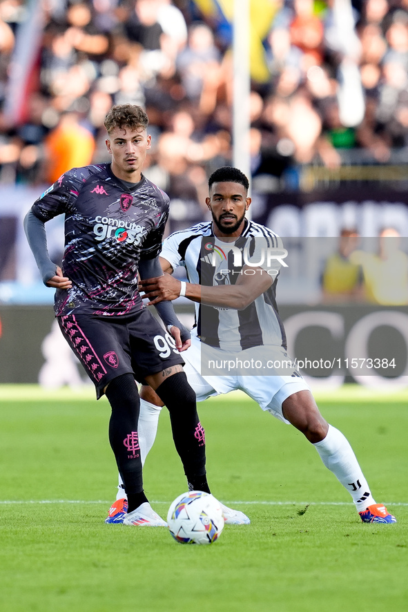 Sebastiano Esposito of Empoli FC and Bremer of Juventus FC compete for the ball during the Serie A Enilive match between Empoli FC and Juven...