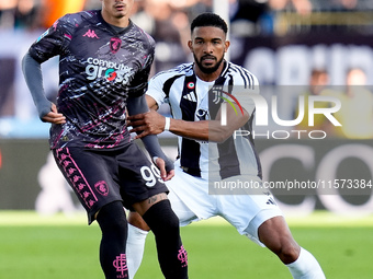 Sebastiano Esposito of Empoli FC and Bremer of Juventus FC compete for the ball during the Serie A Enilive match between Empoli FC and Juven...