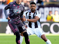 Sebastiano Esposito of Empoli FC and Bremer of Juventus FC compete for the ball during the Serie A Enilive match between Empoli FC and Juven...