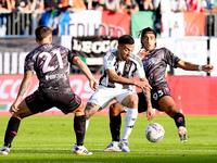 Youssef Maleh of Empoli FC and Nicolas Gonzalez of Juventus FC compete for the ball during the Serie A Enilive match between Empoli FC and J...