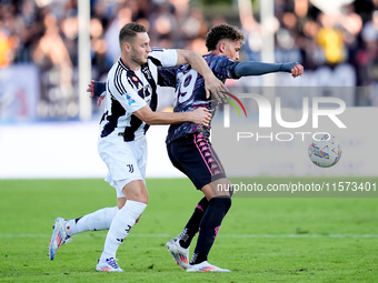 Sebastiano Esposito of Empoli FC and Teun Koopmeiners of Juventus FC compete for the ball during the Serie A Enilive match between Empoli FC...