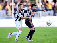 Sebastiano Esposito of Empoli FC and Teun Koopmeiners of Juventus FC compete for the ball during the Serie A Enilive match between Empoli FC...