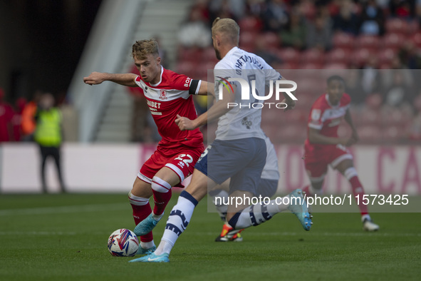 Tommy Conway of Middlesbrough takes on Jack Whatmough of Preston North End during the Sky Bet Championship match between Middlesbrough and P...