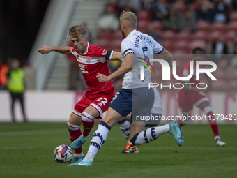 Tommy Conway of Middlesbrough takes on Jack Whatmough of Preston North End during the Sky Bet Championship match between Middlesbrough and P...