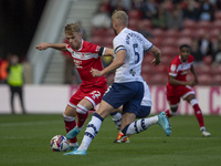 Tommy Conway of Middlesbrough takes on Jack Whatmough of Preston North End during the Sky Bet Championship match between Middlesbrough and P...