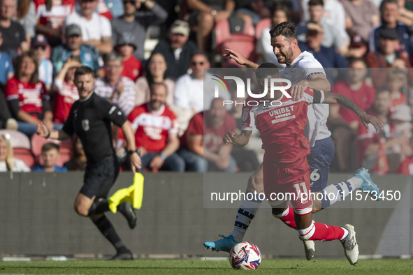 Isaiah Jones of Middlesbrough is fouled by Liam Lindsay of Preston North End during the Sky Bet Championship match between Middlesbrough and...