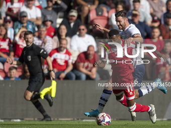 Isaiah Jones of Middlesbrough is fouled by Liam Lindsay of Preston North End during the Sky Bet Championship match between Middlesbrough and...