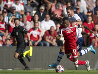 Isaiah Jones of Middlesbrough is fouled by Liam Lindsay of Preston North End during the Sky Bet Championship match between Middlesbrough and...