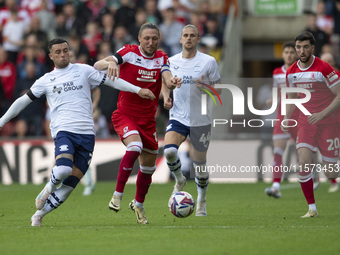 Luke Ayling of Middlesbrough takes on Sam Greenwood of Preston North End during the Sky Bet Championship match between Middlesbrough and Pre...