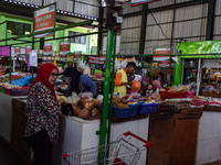 Activities of visitors and vegetable traders at Oro Oro Dowo traditional market in Malang, East Java, Indonesia, on September 14, 2024. This...