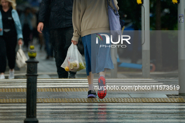 People with umbrellas are seen during a bout of rain in Warsaw, Poland on 14 September, 2024. Warnings for heavy rainfall and severe floodin...