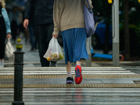 People with umbrellas are seen during a bout of rain in Warsaw, Poland on 14 September, 2024. Warnings for heavy rainfall and severe floodin...