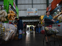 Activities of visitors and traders at Oro Oro Dowo traditional market in Malang, East Java, Indonesia, on September 14, 2024. This tradition...