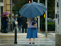 People with umbrellas are seen during a bout of rain in Warsaw, Poland on 14 September, 2024. Warnings for heavy rainfall and severe floodin...