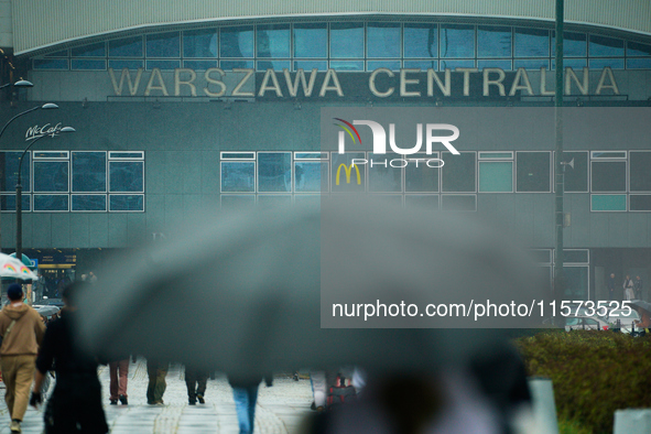 People with umbrellas are seen during a bout of rain in Warsaw, Poland on 14 September, 2024. Warnings for heavy rainfall and severe floodin...