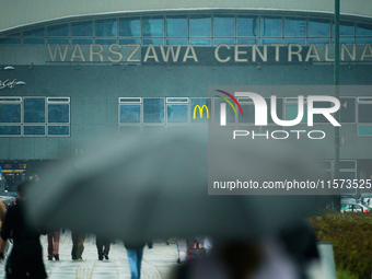 People with umbrellas are seen during a bout of rain in Warsaw, Poland on 14 September, 2024. Warnings for heavy rainfall and severe floodin...