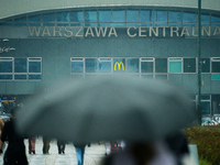 People with umbrellas are seen during a bout of rain in Warsaw, Poland on 14 September, 2024. Warnings for heavy rainfall and severe floodin...