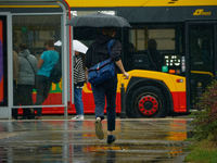 People with umbrellas are seen during a bout of rain in Warsaw, Poland on 14 September, 2024. Warnings for heavy rainfall and severe floodin...