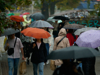 People with umbrellas are seen during a bout of rain in Warsaw, Poland on 14 September, 2024. Warnings for heavy rainfall and severe floodin...